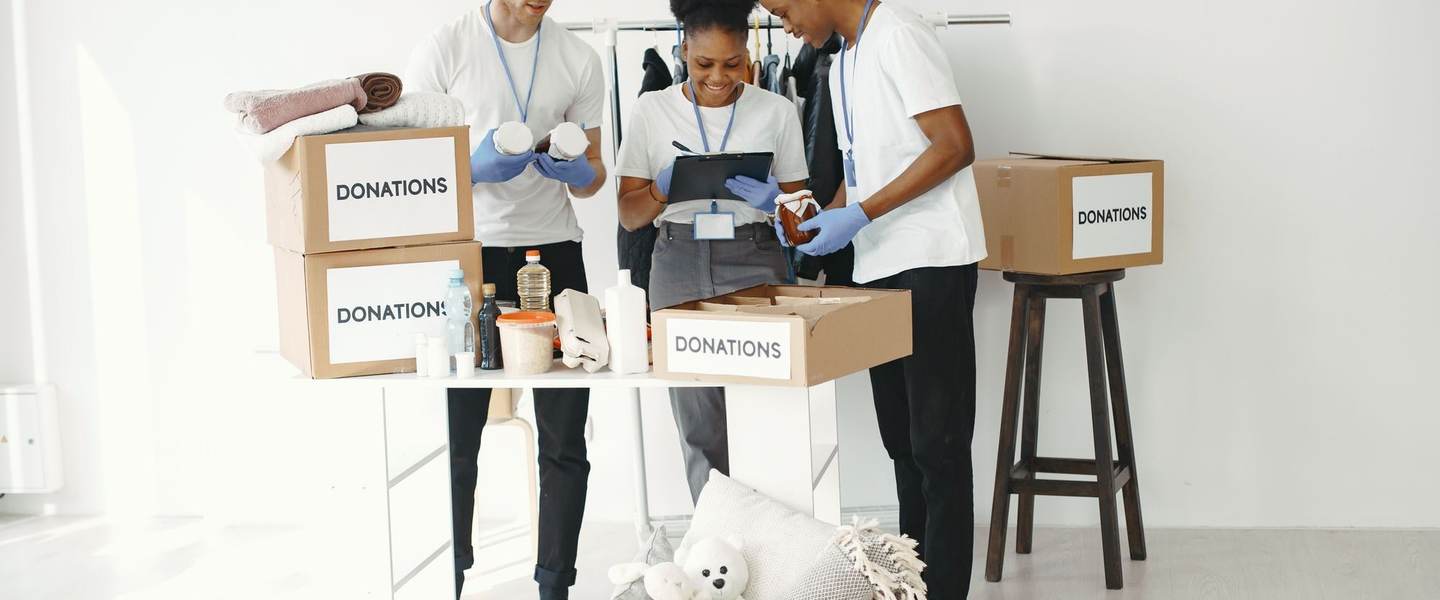 Volunteers organizing boxes of donations