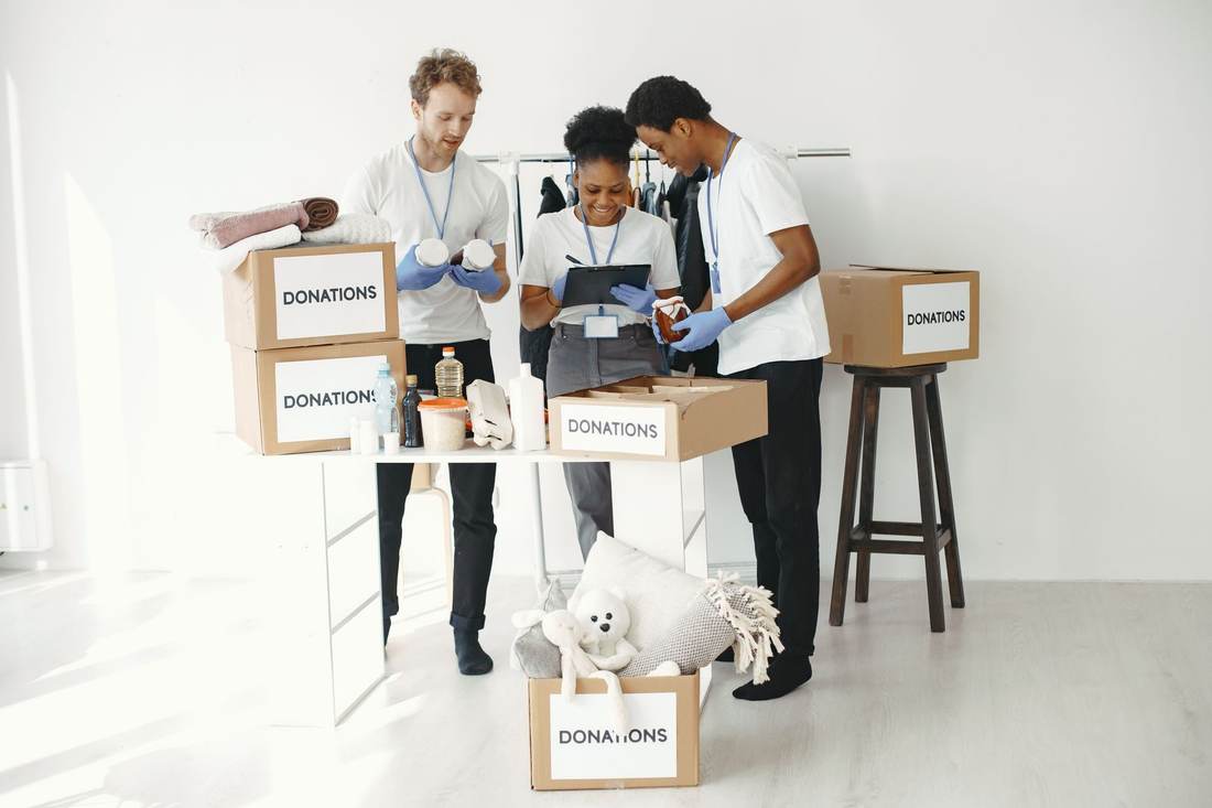 Volunteers organizing boxes of donations