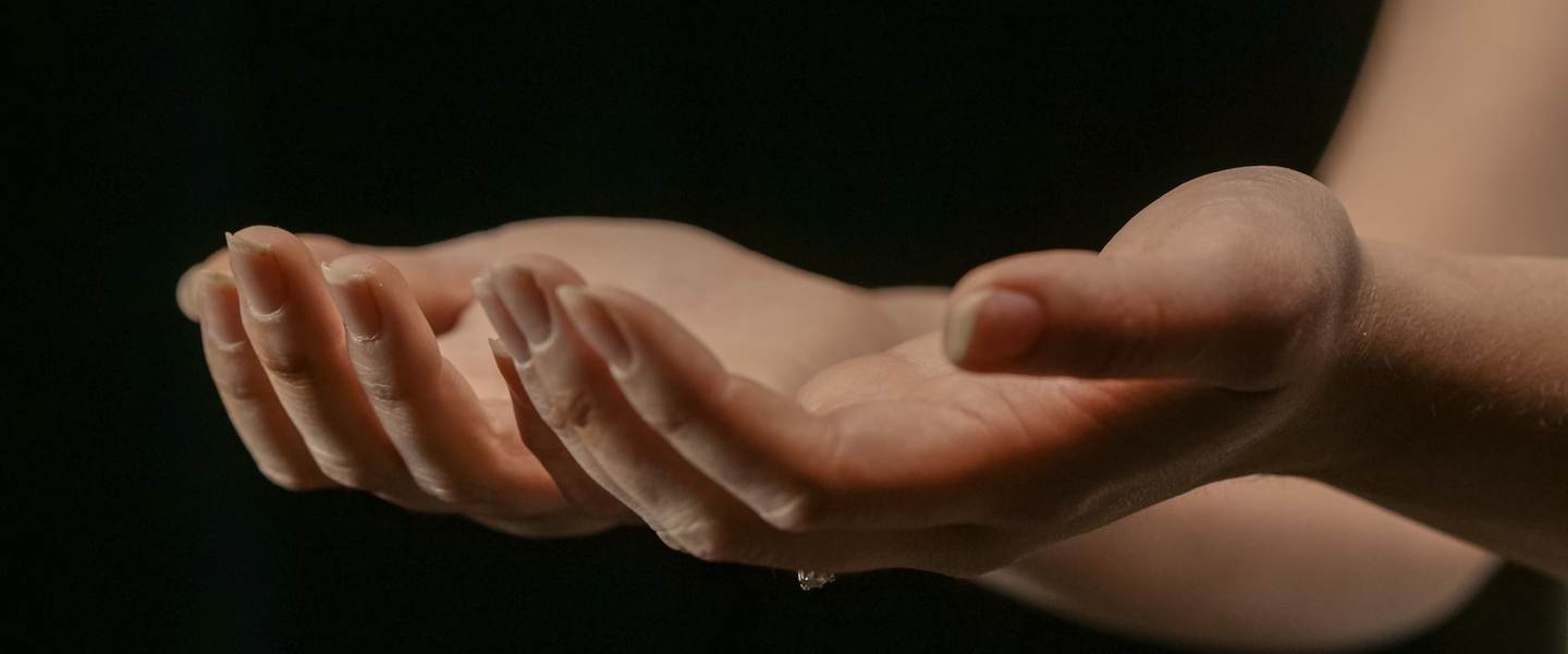 Open hands held out in a gesture of giving